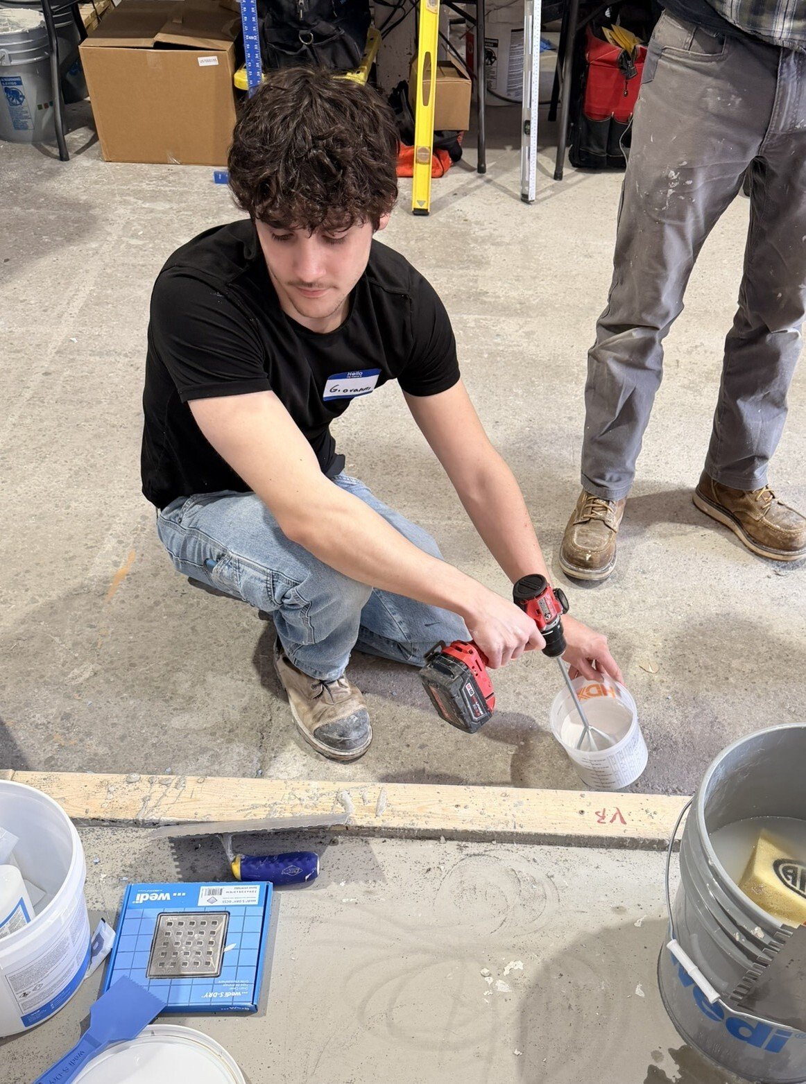 Giovanni, owner of Siena Tile, installing tile on site